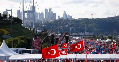 People wave Türkiye's national flags as they arrive to attend a ceremony marking the first anniversary of the July 15 coup attempt at the Bosphorus Bridge in Istanbul, Türkiye, July 15, 2017. (Reuters Photo)