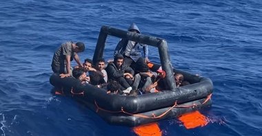 The Turkish coast guard picks up an inflatable life raft carrying irregular migrants pushed back by Greece off the coast of western Muğla province, Türkiye, July 15, 2024. (AA Photo)