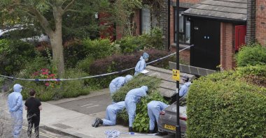 Forensic officers work at an address in Shepherd's Bush, after human remains were found in two suitcases near the Clifton Suspension Bridge, Bristol, London, U.K., July 13, 2024. (AP Photo)