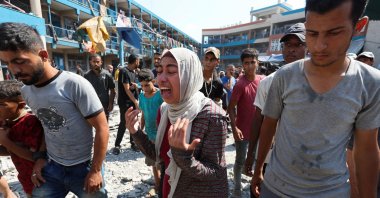 A Palestinian woman reacts at the site of an Israeli airstrike on a U.N. school sheltering displaced people, Nusairat, Gaza Strip, Palestine, July 14, 2024. (Reuters Photo)