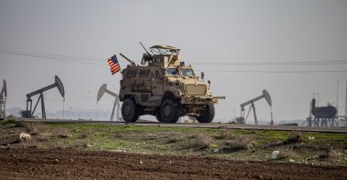 A U.S. military vehicle patrols the countryside near the town of Qamishli, Syria, Dec. 4, 2022. (AP Photo)