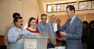Syria's President Bashar Assad casts his vote during parliamentary elections, in Damascus, Syria July 15, 2024. (SANA/Handout via Reuters)