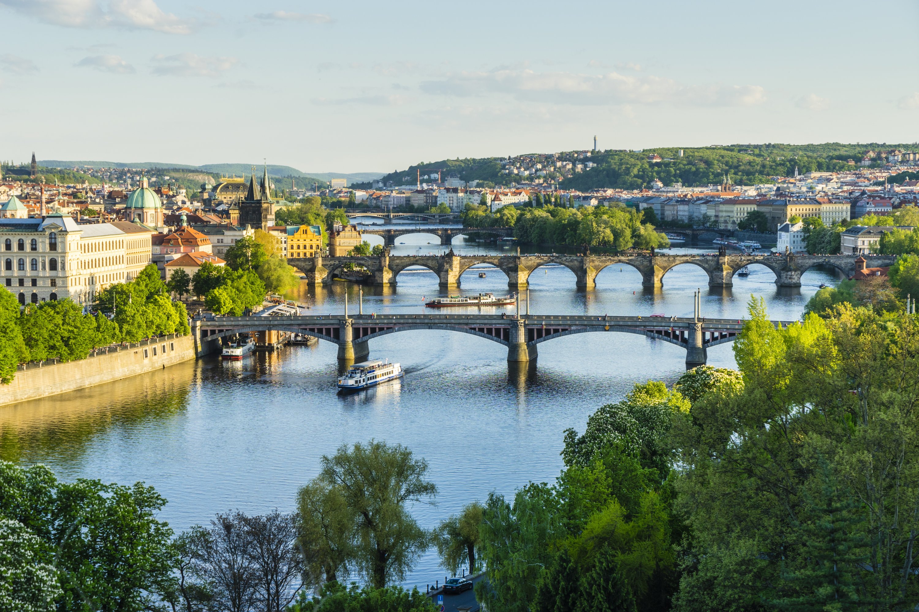 The Prague cityscape looking down the Vltava River at its bridges connecting the Old Town to Mala Strana, Prague Castle and Hradcany, Czechia, May 7, 2015. (Getty Images)