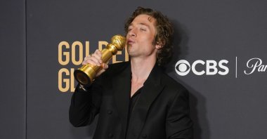 Jeremy Allen White poses in the press room with the award for best performance by an actor in a television series, musical or comedy for &quot;The Bear&quot; at the 81st Golden Globe Awards at the Beverly Hilton in Beverly Hills, California, U.S., Jan. 7, 2024. (AP Photo)