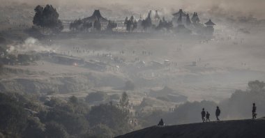 Luhur Poten Temple is surrounded by dust as Tenggerese Hindu worshippers and villagers gather at Mount Bromo's crater to throw their offerings, during the Yadnya Kasada festival in Probolinggo, East Java, Indonesia, June 22, 2024. (Reuters Photo)