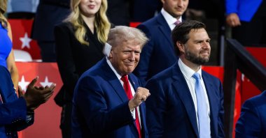 Republican presidential nominee and former President Donald Trump (L) alongside his vice presidential nominee J.D. Vance, look on during the evening session on the opening day of the Republican National Convention (RNC) at the Fiserv Forum, Milwaukee, Wisconsin, U.S., July 15, 2024. (EPA Photo)