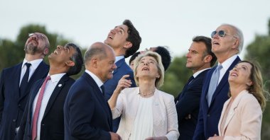 From right, Italian Prime Minister Giorgia Meloni, U.S. President Joe Biden, French President Emmanuel Macron, European Commission President Ursula von der Leyen, Japan's Prime Minister Fumio Kishida, Canada's Prime Minister Justin Trudeau, German Chancellor Olaf Scholz, Britain's then-Prime Minister Rishi Sunak and European Council President Charles Michel watch a skydiving demo during the G-7 world leaders summit, Borgo Egnazia, Italy, June 13, 2024. (AP Photo)