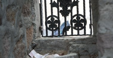 Money left by citizens on the charity stone from the Ottoman period is given to those in need, Çankırı, Türkiye, July 16. 2024. (IHA Photo) 