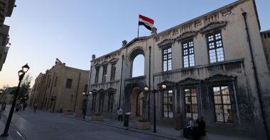 The flag of Iraq is seen at Saray Alley in the Old City of Baghdad after its reopening in the center of the Iraqi capital, Baghdad, Iraq, June 26, 2024. (AFP Photo)