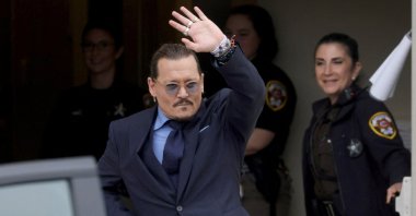 Actor Johnny Depp gestures as he leaves the Fairfax County Circuit Courthouse following his defamation trial against his ex-wife Amber Heard, Fairfax, Virginia, U.S., May 27, 2022. (Reuters Photo)