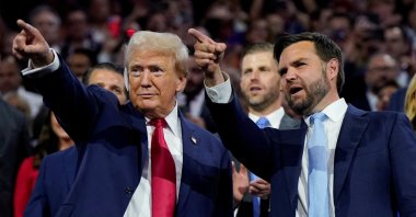 Republican presidential nominee and former U.S. President Donald Trump and Republican vice presidential nominee J.D. Vance point to the stage during Day 1 of the Republican National Convention (RNC), at the Fiserv Forum in Milwaukee, Wisconsin, U.S., July 15, 2024. (Reuters Photo)