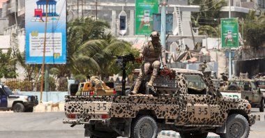 A Somali security officer stands guard near Syl Hotel, the scene of an al-Shabab terrorist attack, Mogadishu, Somalia, March 15, 2024. (Reuters Photo)