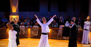 International students watching sema whirling in Konya, Türkiye, July 11, 2024. (AA Photo) 

