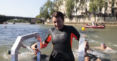Paris Mayor Anne Hidalgo gets up after swimming in the river Seine ahead of the Olympics, Seine River, Paris, France, July 17, 2024. (Reuters Photo)