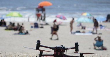A drone with emergency flotation devices attached prepares to launch at Rockaway Beach, New York, U.S., July 11, 2024. (AP Photo)