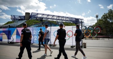 French police patrol a street near the Bercy Arena, ahead of the Paris 2024 Olympic and Paralympic Games, Paris, France, July 4, 2024. (Reuters Photo)
