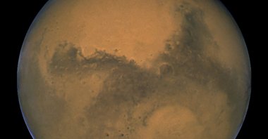 This image made available by NASA shows Mars as it lines up with the sun and the Earth,  Aug. 26, 2003. (AP Photo)