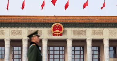 A paramilitary police officer stands guard, on the day of the opening session of the Chinese People's Political Consultative Conference (CPPCC), in front of the Great Hall of the People, Beijing, China, March 4, 2024. (Reuters Photo)