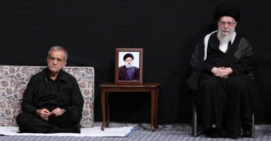 A handout picture provided by the office of Iran's Supreme Leader Ayatollah Ali Khamenei shows him (R) and Iran's newly-elected President Masoud Pezeshkian attending a mourning ritual, in Tehran, Iran, July 12, 2024. (AFP Photo)