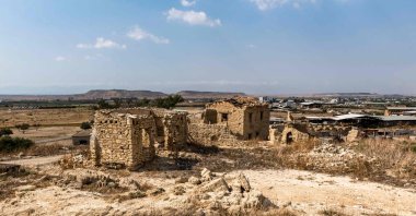The ruins of Turkish Cypriot houses stand in Esendağ (Petrofani), in the south of the divided island of Cyprus, July 13, 2024. (AFP Photo)