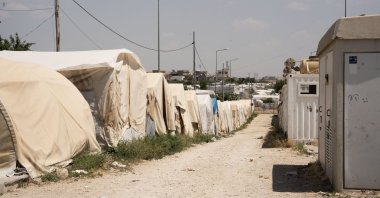 Tents line up on a dirt road at the Sharia refugee camp for Yazidis in northern Duhok province, Iraq, June 26, 2024. (AA Photo)