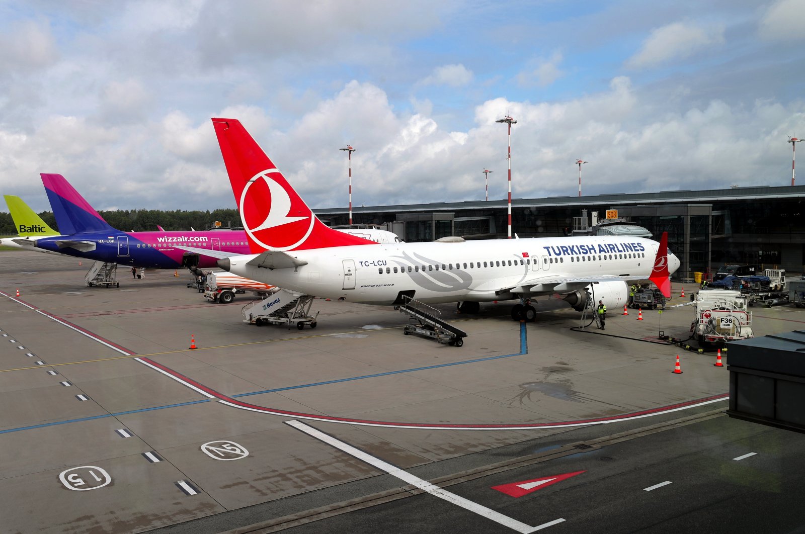 A Turkish Airlines Boeing 737 Max 8 (R), Wizz Air Airbus A321-271NX (C) and airBaltic aircraft are seen at Riga Airport in Riga, Latvia, July 3, 2024. (EPA Photo)