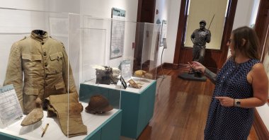 Curator Cori Convertito shows off Ernest Hemingway's World War I ambulance driver uniform and other belongings at the Key West Museum of Art &amp; History at the Custom House, Key West, Florida, U.S., July 15, 2024. (AP Photo)