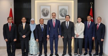 Foreign Minister Hakan Fidan (C) poses with ASEAN Ankara Committee, in the capital Ankara, Türkiye, July 8, 2024. (AA Photo)