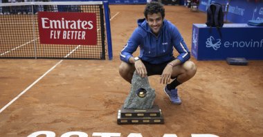 Italy's Matteo Berrettini poses with the trophy after winning the Swiss Open in Gstaad, Switzerland, July 21, 2024. (AP Photo)