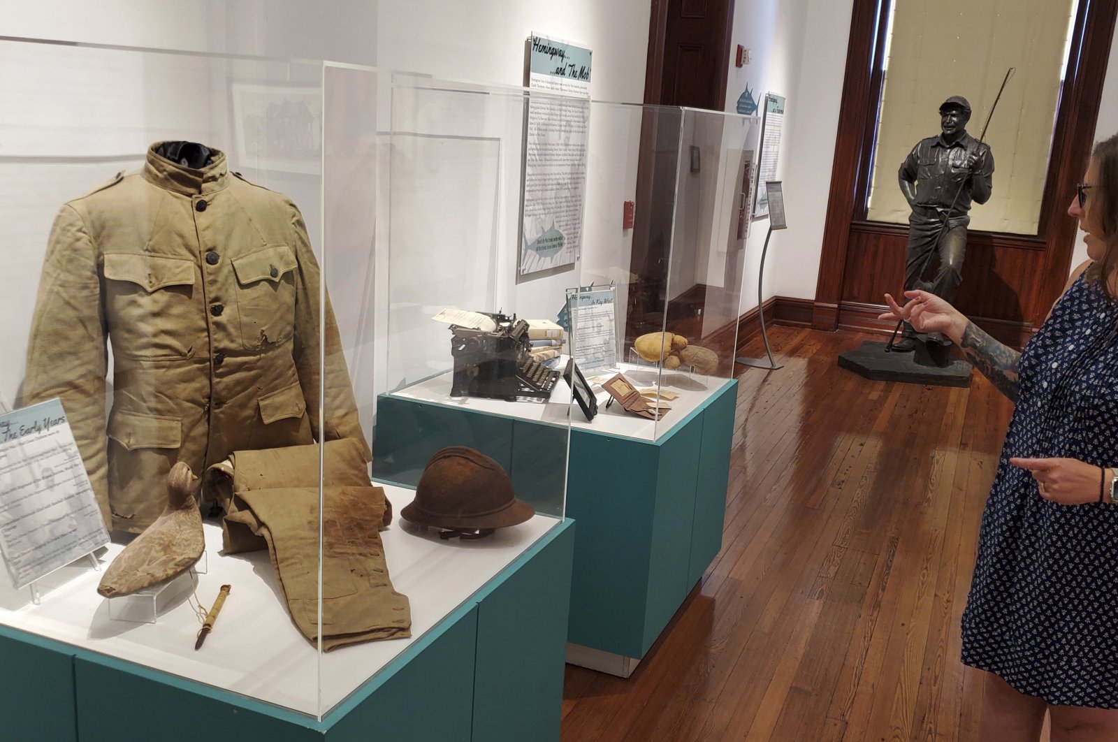 Curator Cori Convertito shows off Ernest Hemingway&#039;s World War I ambulance driver uniform and other belongings at the Key West Museum of Art &amp; History at the Custom House, Key West, Florida, U.S., July 15, 2024. (AP Photo)