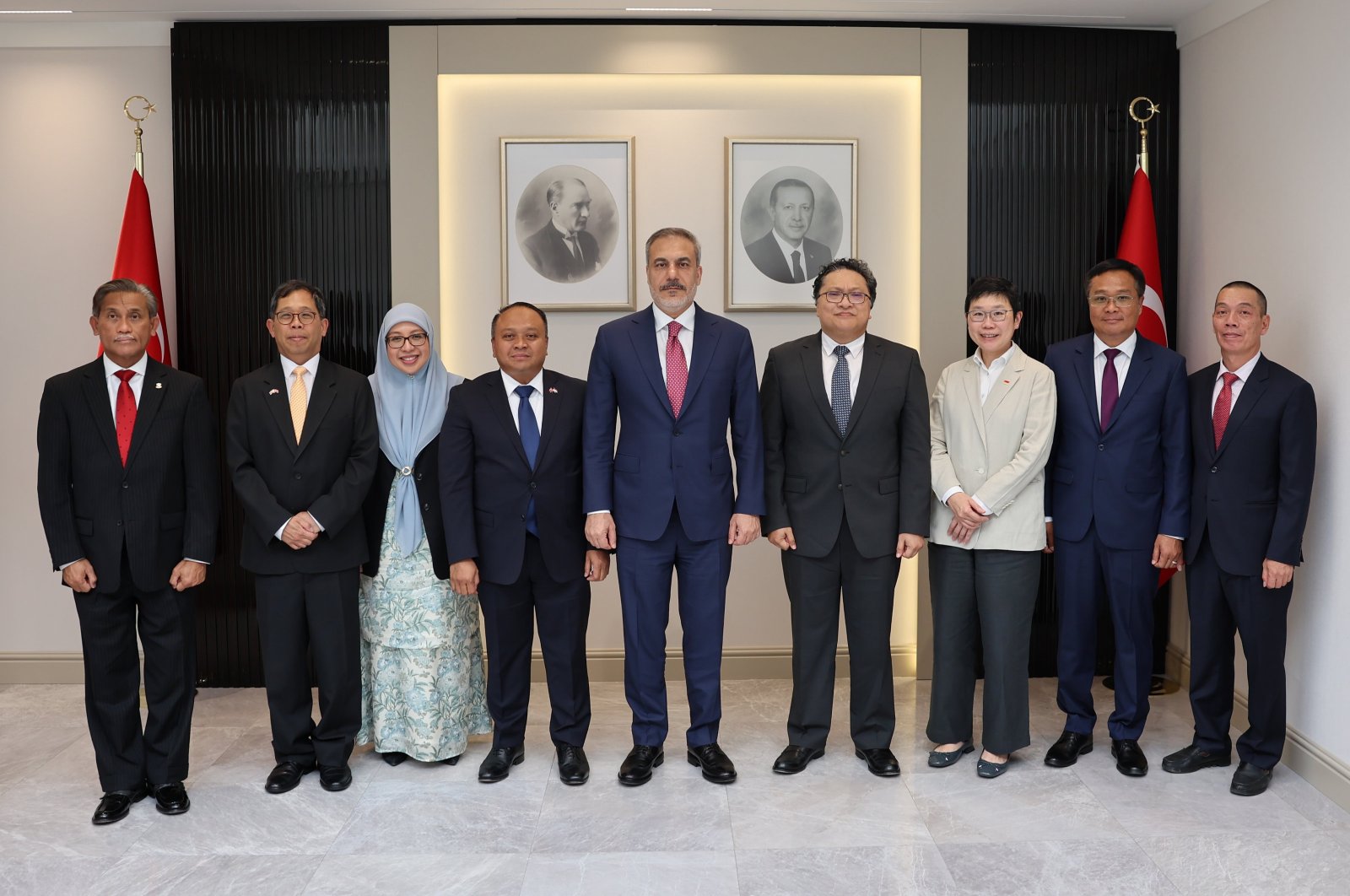 Foreign Minister Hakan Fidan (C) poses with ASEAN Ankara Committee, in the capital Ankara, Türkiye, July 8, 2024. (AA Photo)