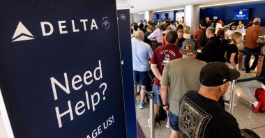 Travelers wait in line at check-in in Terminal 2, Delta Air Lines, at Los Angeles International Airport, Los Angeles, U.S., July 19, 2024. (AFP Photo)
