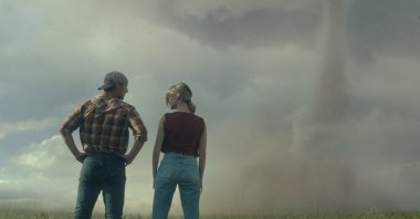 This image released by Universal Pictures shows Glen Powell, left and Daisy Edgar-Jones in a scene from &quot;Twisters.&quot; (AP Photo)