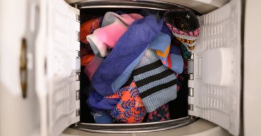 Why is it that we always end up with an odd number of socks? If you suspect your washing machine might have something to do with it, experts recommend you take a closer look at the appliance's age. (DPA Photo)
