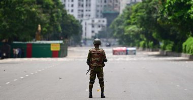 A Bangladesh army personnel stands guard near the Parliament house amid a curfew in Dhaka, Bangladesh, July 22, 2024. (AFP Photo)