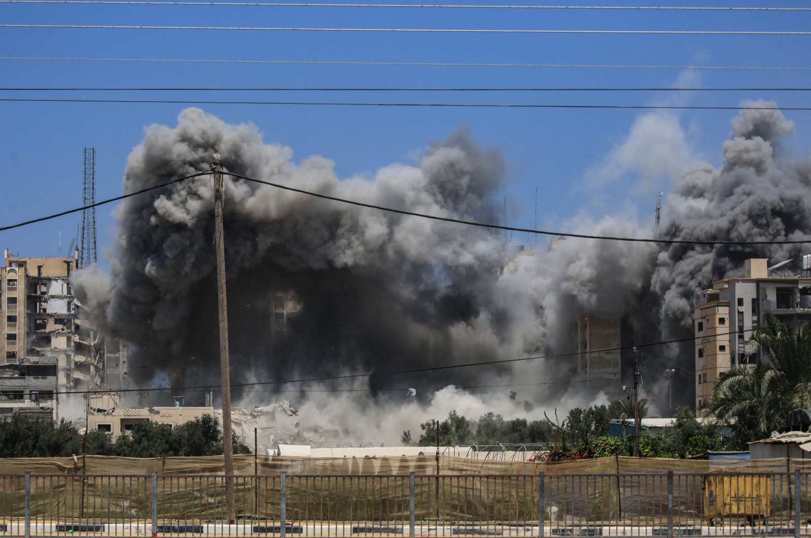 Smoke rises from a building hit by an Israeli strike in Nuseirat in the central Gaza Strip, Palestine, July 20, 2024. (AFP Photo)