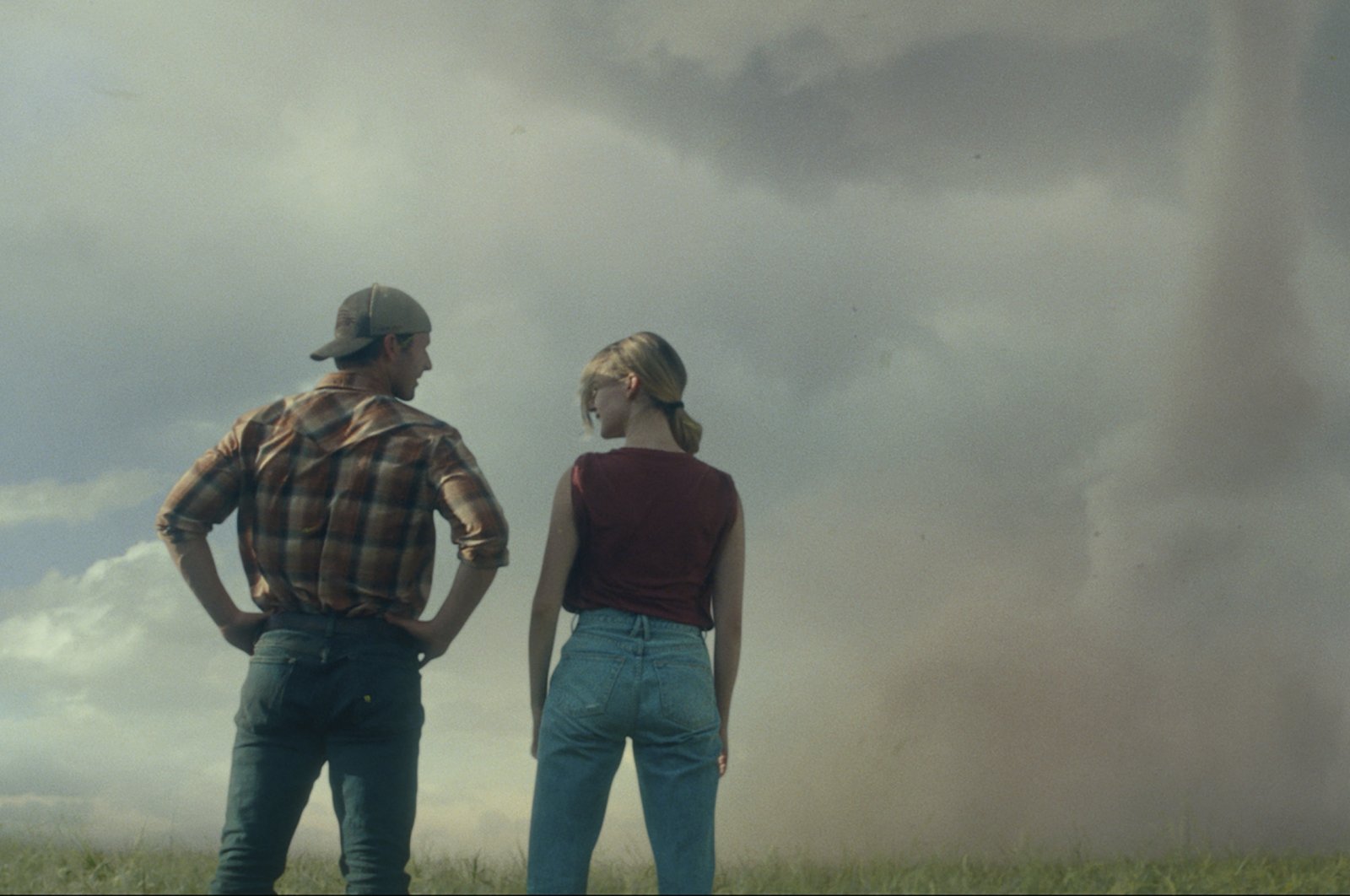 This image released by Universal Pictures shows Glen Powell, left and Daisy Edgar-Jones in a scene from &quot;Twisters.&quot; (AP Photo)