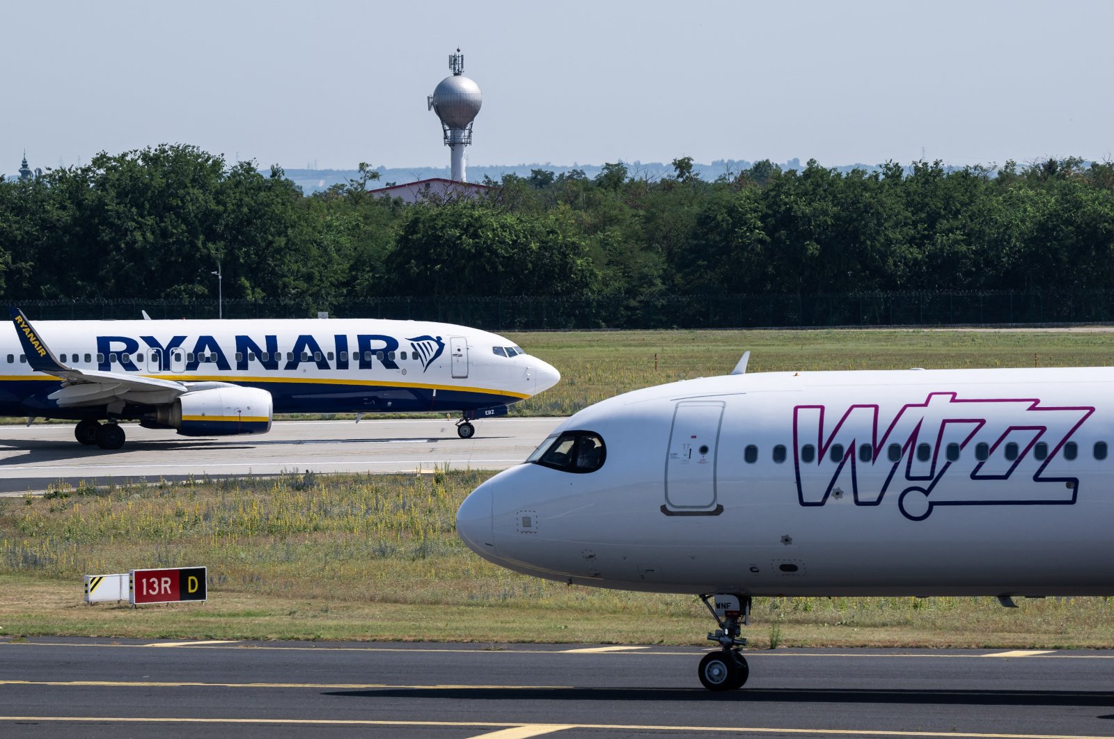 Ryanair and a Wizz Air aircraft are seen on the runway at Ferenc Liszt International Airport in Budapest, Hungary, July 9, 2024. (Reuters Photo)