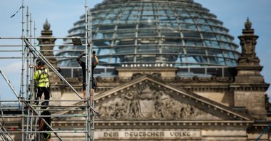 Workers on a scaffold dismantle parts of the former fan zone, the public screening area of the past soccer tournament UEFA EURO 2024, in front of parliament, Berlin, Germany, July 18, 2024. (EPA Photo)