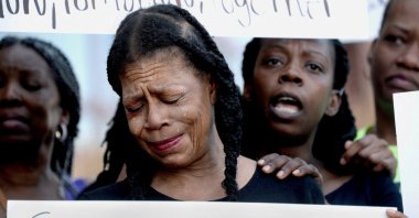 Donna Massey mourns the loss of her daughter, Sonya, who was shot and killed by Sangamon County Sheriff's Deputies July 6, during a protest over her daughter's death in front of the Sangamon County Building in Springfield, Illinois, U.S., July 12, 2024.  (Thomas J. Turney/The State Journal-Register/USA Today Network via Reuters)
