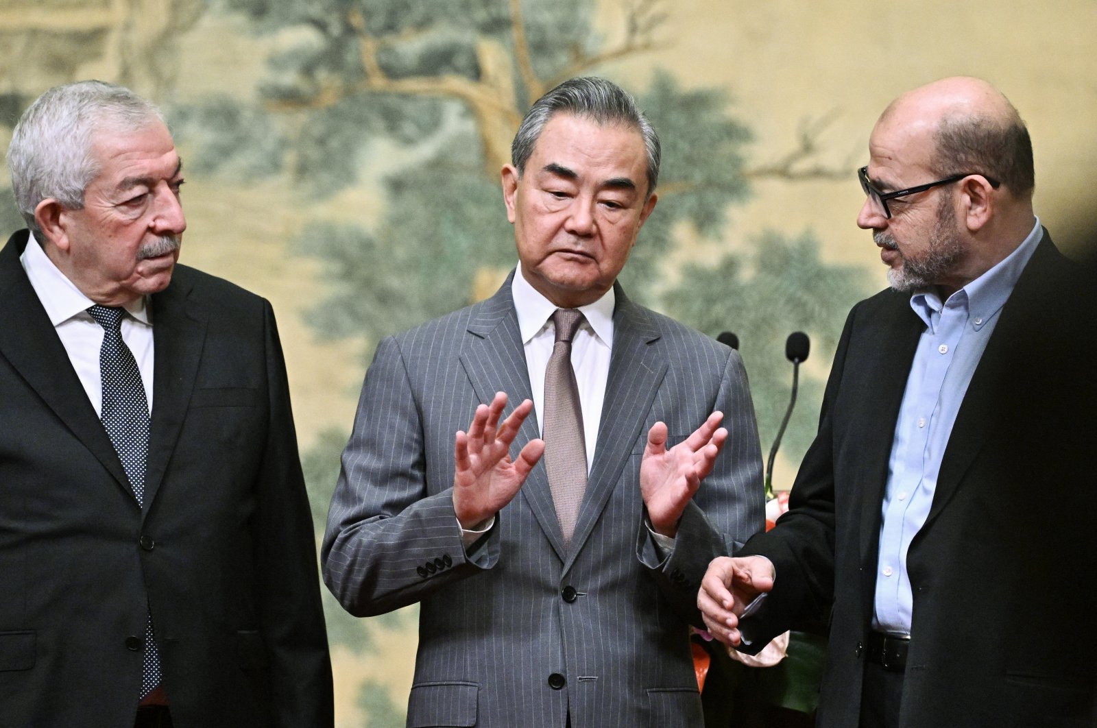  (Left to Right) Mahmoud al-Aloul, Vice Chairman of the Central Committee of Palestinian organization and political party Fatah, China&#039;s Foreign Minister Wang Yi, and Mussa Abu Marzuk, a senior member of the Palestinian resistance movement Hamas, attend an event at the Diaoyutai State Guesthouse in Beijing, China, 23 July 2024. (EPA Photo)