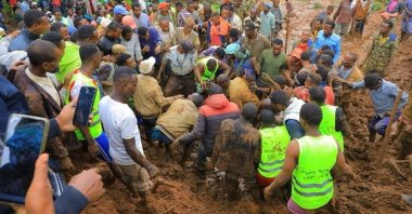 Residents and rescuers dig to recover the dead body of a victim of the landslide following heavy rains in Gofa zone, Southern Ethiopia, July 23, 2024. (Reuters Photo)