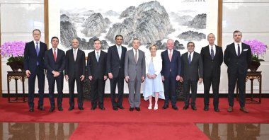 In this photo released by Xinhua News Agency, Chinese Foreign Minister Wang Yi (6th L) poses for a photo with a United States business delegation including FedEx CEO Raj Subramaniam (5th L) and Chindex CEO Roberta Lipson (5th R), Beijing, China, July 22, 2024. (AP Photo)