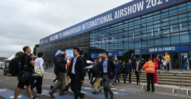 People are photographed at the entrance to Farnborough International Airshow, Farnborough, U.K., July 23, 2024. (AA Photo)