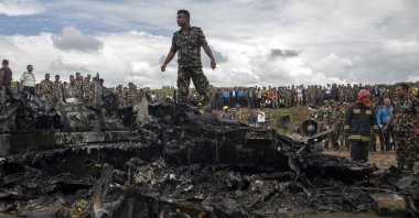 Rescue workers work at the crash site at Tribhuvan International Airport in Kathmandu, Nepal, July 24, 2024. (EPA Photo)