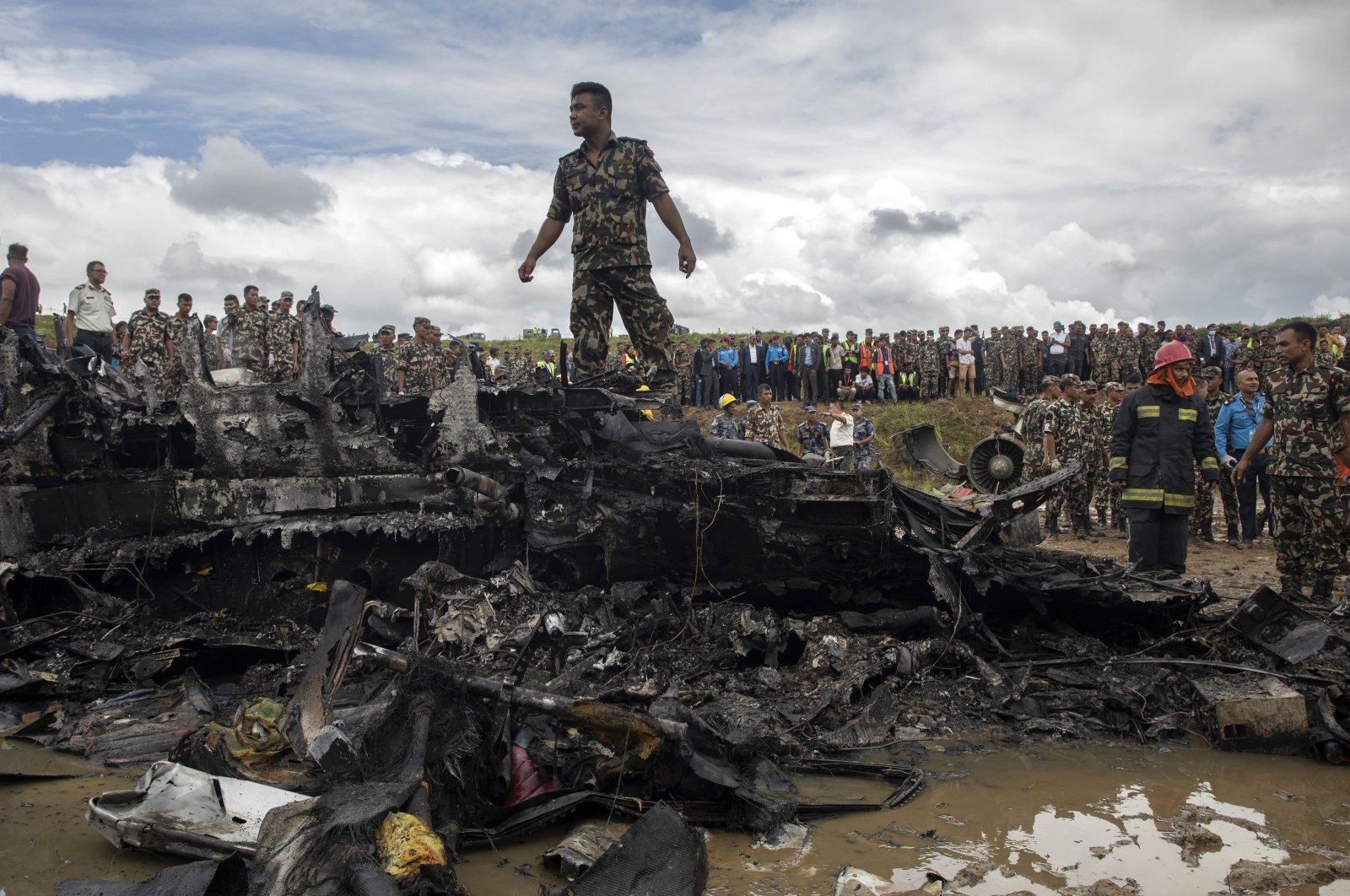 Rescue workers work at the crash site at Tribhuvan International Airport in Kathmandu, Nepal, July 24, 2024. (EPA Photo)