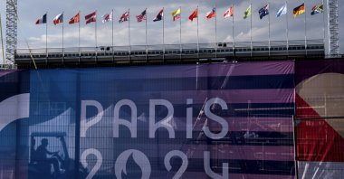 A worker drives a golf cart inside the competition venue for BMX freestyle ahead of the 2024 Summer Olympics, Paris, France, July 19, 2024. (AP Photo)