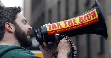 A protester speaks to participants in a May Day march in Albany, N.Y., U.S., May 1, 2012. (AP Photo)