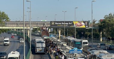 People wait at the Altunizade Metrobus station on the Anatolian side of Istanbul, Türkiye, July 18, 2024. (AA Photo)