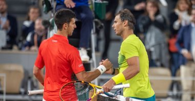 Spain&#039;s Rafael Nadal (R) is congratulated at the net by Serbia&#039;s Novak Djokovic on Court Philippe Chatrier during the singles quarterfinal match at the 2022 French Open Tennis Tournament at Roland Garros, Paris, France, May 31, 2022. (Getty Images Photo)
